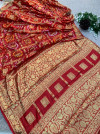 Maroon hand bandhej silk saree with zari weaving work