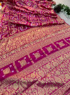 Rani pink hand bandhej silk saree with zari weaving work