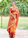 Orange and maroon color bandhej silk saree with zari weaving work