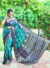 Dark green and purple color bandhej silk saree with zari weaving work