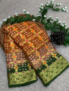 Mustard yellow and green color hand bandhej silk saree with zari weaving work