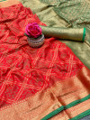 Red color patola silk saree with golden zari weaving work
