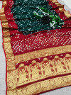Maroon and green color bandhej silk saree with zari weaving work