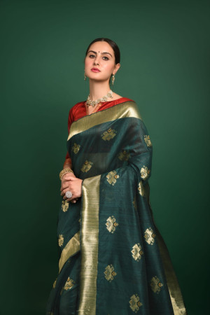 Bottle green color tussar silk saree with woven design