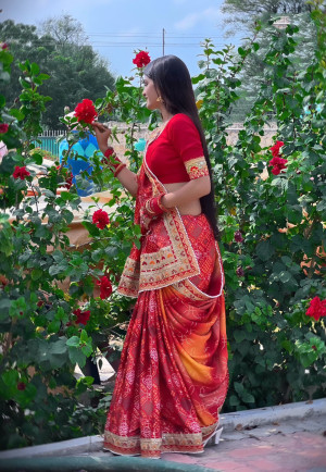 Red color Dola silk saree with printed and sequence work