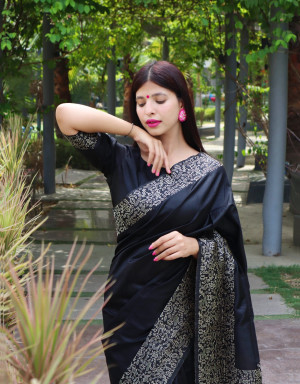 Black color raw silk saree with woven design