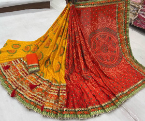 Yellow and orange color dola silk saree with gota patti work