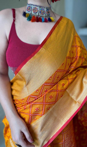 Mustard yellow color patola silk saree with zari woven work