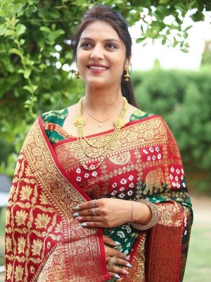 Rama green and red color bandhej silk saree with zari weaving work