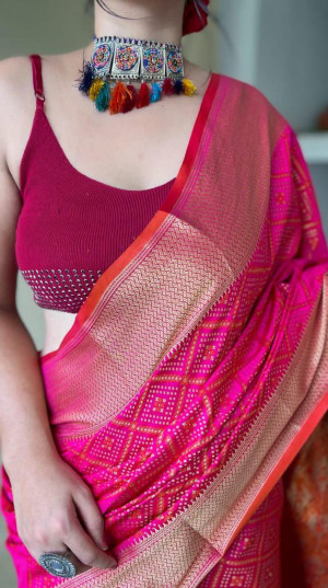Rani pink color patola silk saree with zari woven work