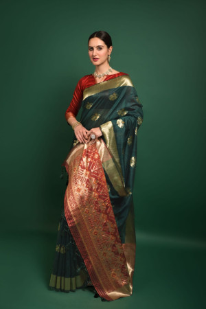 Bottle green color tussar silk saree with woven design