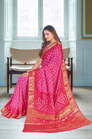 Pink color bandhej silk saree with zari weaving work