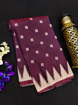 Magenta color raw silk saree with temple woven border