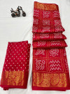 Red color tussar silk saree with bandhani printed work