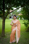 Peach tussar silk saree with checks weaving work