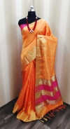 Orange color raw silk saree with golden zari weaving temple border