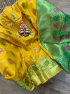 Yellow colored Soft banarasi silk saree with woven design