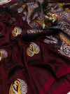 Maroon color lichi silk saree with silver and golden zari work