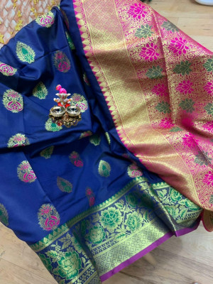 Navy blue colored Soft banarasi silk saree with woven design