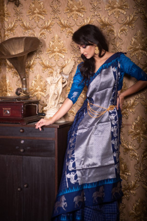 Blue color soft raw silk saree with zari work