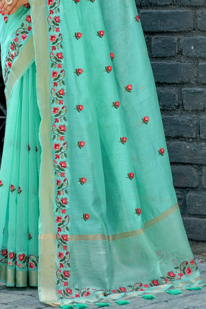 Sea green color linen cotton saree with embroidery work