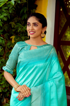Sea green color south silk saree with zari woven contrast border