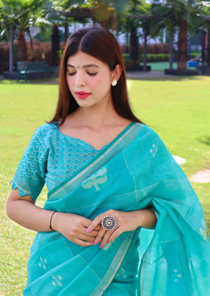 Sea green color pure linen silk saree with zari weaving work