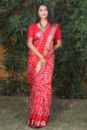 Red color bandhej silk saree with zari weaving work