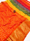 Orange color cotton silk saree with bandhej printed work