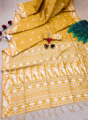 Yellow color raw silk saree with zari weaving work