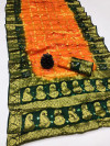 Orange and dark green color hand bandhej silk saree with zari weaving work