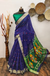Purple color raw silk saree with zari woven work
