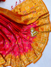 Gajari and yellow color patola silk saree with golden zari weaving work