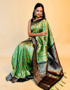 Green color banarasi silk saree with patola weaving work