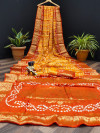 Yellow and orange color pure hand bandhej silk saree with zari weaving work