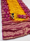 Yellow and rani pink color art silk saree with zari weaving work