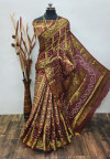 Brown and maroon color hand bandhej silk saree with zari weaving work