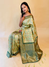 Light green color banarasi silk saree with patola weaving work