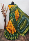 Yellow and green color hand bandhej silk saree with zari weaving work