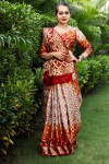 Beige and maroon color hand bandhej silk saree with zari weaving work