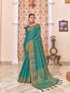 Rama green color patola silk saree with zari weaving work