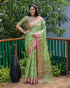 Pista green color linen silk saree with golden zari weaving work