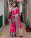 Rani pink color organza silk saree with woven design