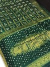 Bottle green color pure hand bandhej silk saree with zari weaving work