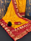 Yellow and maroon color soft art silk saree with zari weaving work