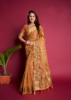 Peach color organza silk saree with embroidered and zari weaving work