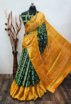 Dark green and yellow color hand bandhej silk saree with zari weaving work