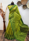 Mahendi green color raw silk saree with woven work