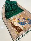 Dark green color paithani silk saree with zari weaving work