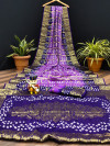 Lavender and purple color pure hand bandhej silk saree with zari weaving work